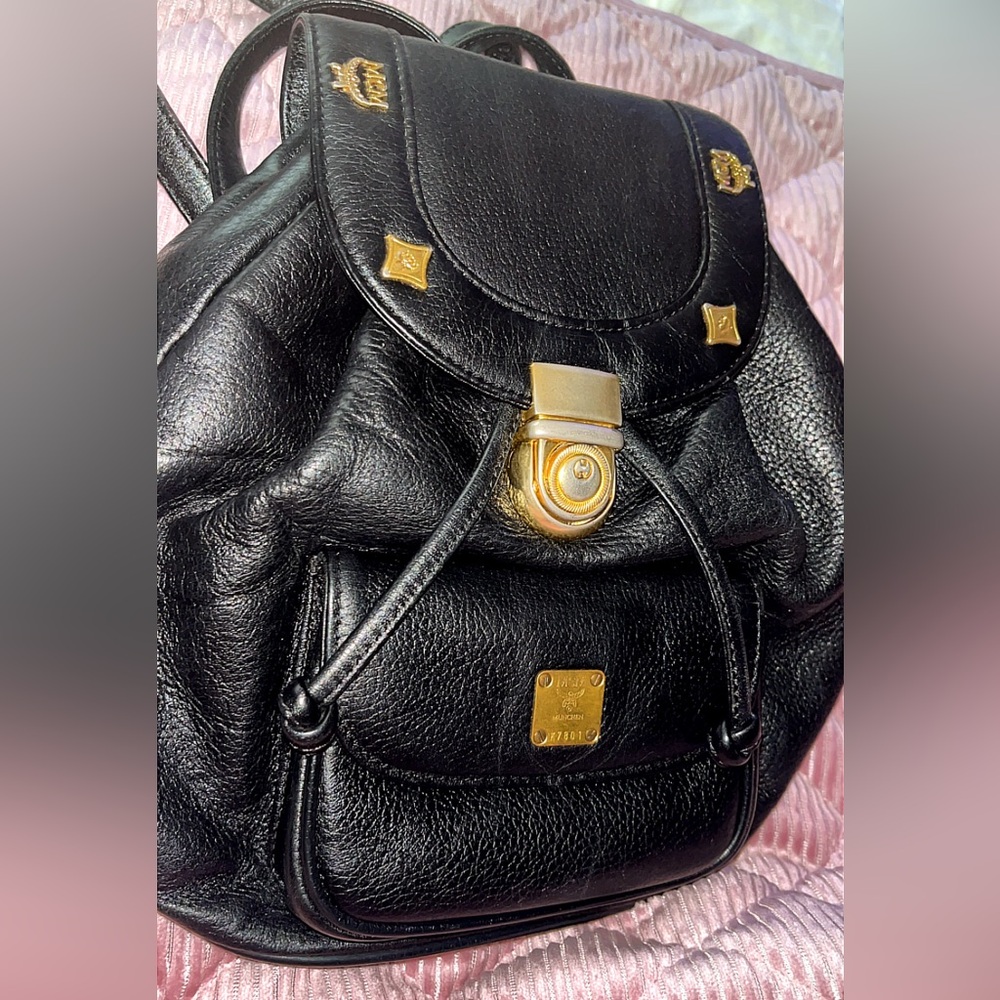 MCM bucket bag Elegant Black Leather Backpack with Gold Hardware